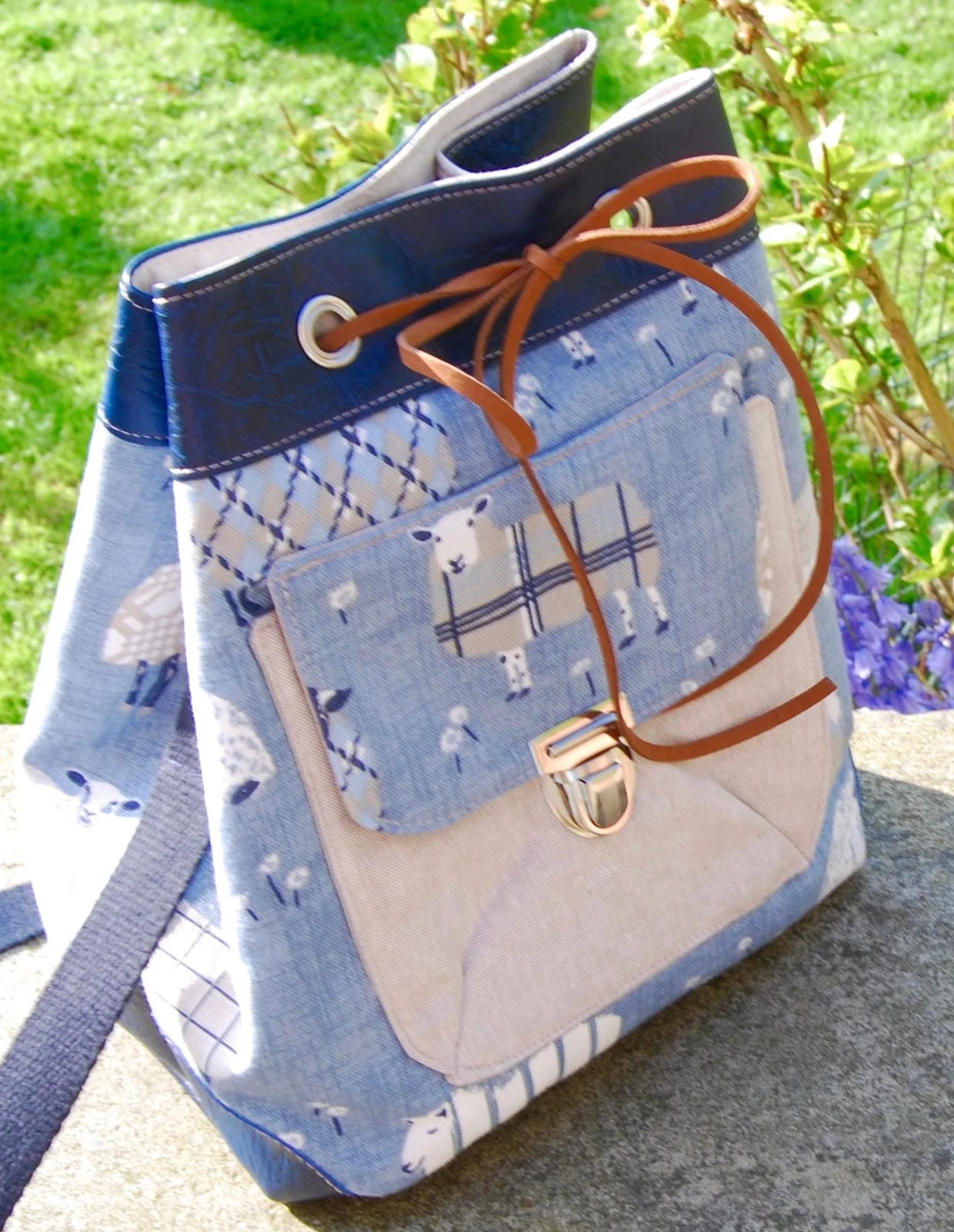 Use Bobbin Girl's eyelets and faux suede cord to create a drawstring bucket bag, handmade by Bobbin Girl