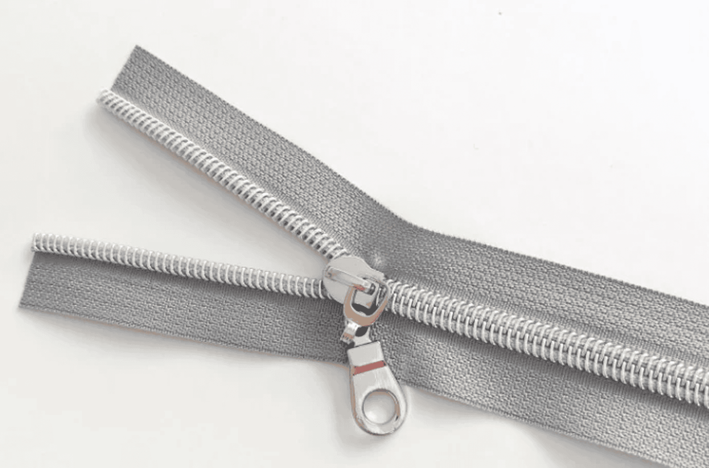Bobbin Girl's No. 5 Grey Zipper Tape is sold by the yard with 3 shiny silver zipper pulls