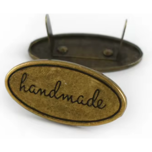 decorate your handbag with an oval handmade badge in antique brass, with prongs and washer for easy fitting